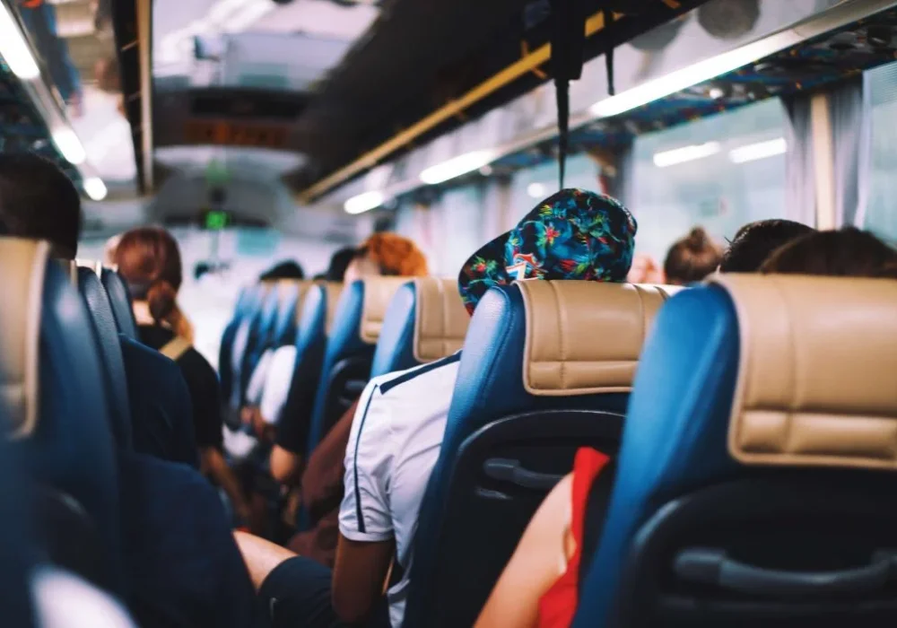 Group of passengers seated in a comfortable coach: a group of passengers seated in a comfortable coach